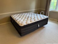 Overall view of king mattress on box spring