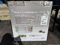 Front of retail box showing MidWest Black E-Coat Exercise Pen details and model information