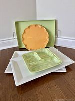 Group of five platters and trays stacked for overview