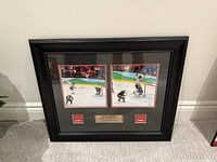 Framed photo collage front view showing two images, plaques, matting and frame