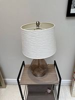 Front view of lamp showing base and shade