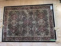 Full view of the rug showing overall pattern, colors, and size ratio