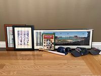 Overall lot showing frames, book, bat, caps and mini helmets