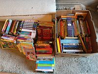 Overview of two stacks and box filled with children’s books