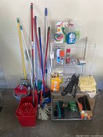 Full view of shelving, handled tools, buckets