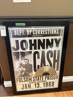 Full view of framed concert poster with gold record
