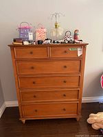 Front view of dresser showing all drawers and finish