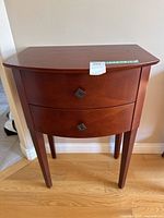 Front view of wooden hall table showing two drawers and overall style