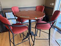 table with four chairs around it