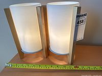 Both matching lamps side by side with measuring tape for scale