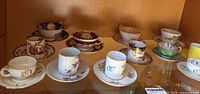 Cabinet view showing all 12 cup and saucer sets
