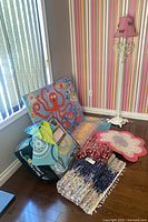 Group shot showing lamp, rugs, bedding set in bag and octopus canvas