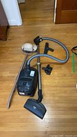 Overview of Miele vacuum, hose, wand, powerhead and floor polisher