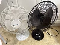 White Airworks and black Ocean Breeze fans side by side