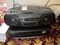 Sony CFD-9 boombox stacked on Sharp VCR