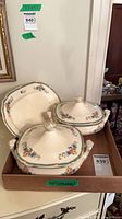 Three Wedgwood serving pieces in box: two lidded dishes and one platter