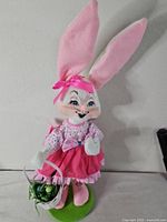 Full view of Annalee bunny doll on stand