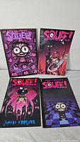 Front covers of all four Squee! comic books displayed