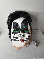 Front view of KISS Catman latex mask with attached hair