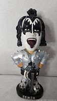 Front view of KISS Demon bobblehead showing face, armor and base