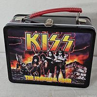 Front view showing KISS Farewell Tour artwork and overall condition