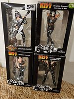 Front view four boxed KISS ornaments