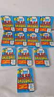 Front view showing 11 sealed Fleer 1990 Baseball card packs