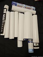 Group of rolled posters showing quantity and rolled storage state