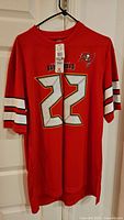Front view of red Buccaneers Doug Martin #22 jersey with tags