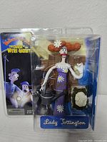 Front view of sealed packaging showing figure and accessories