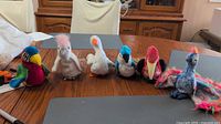 Group shot of six Ty Beanie Babies birds on table