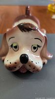 Front view of ceramic dog eyeglasses holder