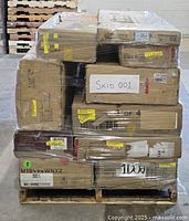 front view of shrink-wrapped pallet with stacked cardboard boxes