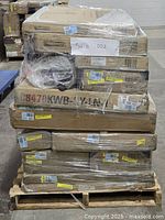 Front view of shrink-wrapped pallet with stacked boxes and label