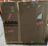 Factory box marked Aarco Products with visible crush and tear damage