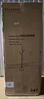 Factory-sealed carton labeled Safavieh item HAC4000B showing shipping wear