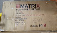 Carton showing Matrix Furniture Group branding, model and specifications
