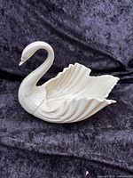 Side view of ivory Lenox swan candy dish showing wing detail