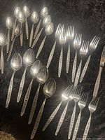 Group view of spoons, forks, knives