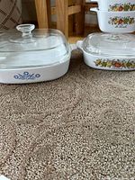Spice of Life and Cornflower Blue casseroles side by side showing patterns and lids