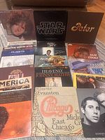 Front view showing 15 LP jackets including Star Wars, Chicago, Simon & Garfunkel, Sam Cooke, Johnny Mathis