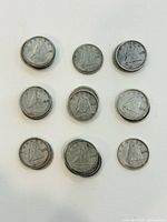 Nine visible stacks of Canadian dimes showing Bluenose schooner reverse