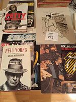 Group shot showing books, tour programs and Dylan print