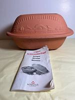 Roaster with lid in place and booklet visible