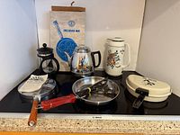 Group shot of all cookware and coffee makers