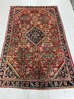 Full view of entire Persian rug showing overall design and dimensions