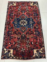 Full view of rectangular red and navy Hamadan rug