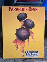Front view of Parapluie-Revel poster showing full artwork and text