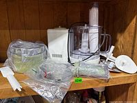 Overall view of processor, bowl, green basket, accessories