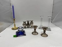 Group shot of all nine candlestick holders showing variety and relative sizes